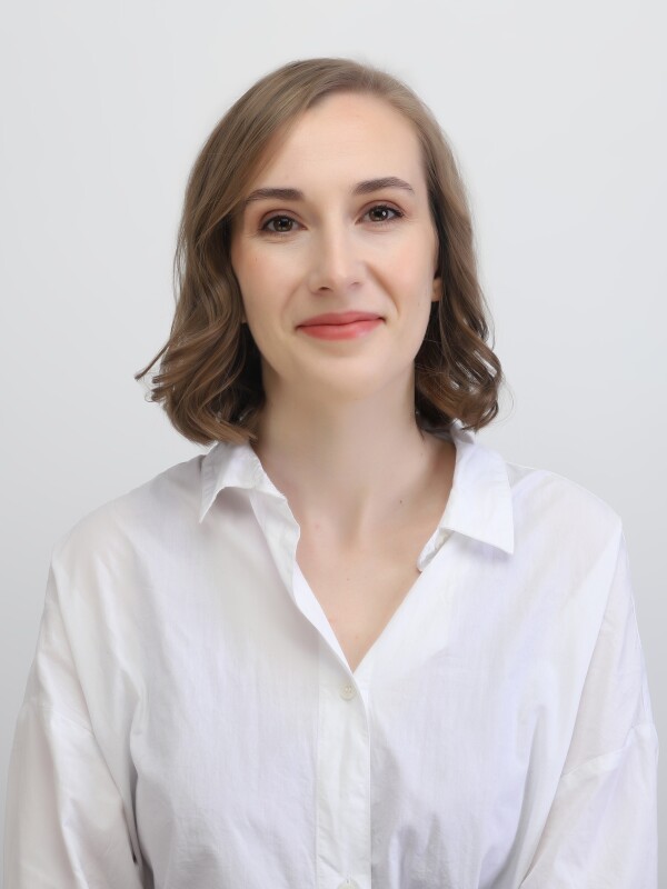 Joanna Morley, Second Hand Dance General Manager Joanna Morley, Second Hand Dance General Manager with short light brown hair, wearing a white button-up shirt, smiling gently against a plain light background.